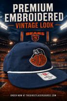 A navy blue Chicago Bears flat-brim cap with orange and white embroidered logo, shown in front of a stadium scene with large promotional text reading 'PREMIUM EMBROIDERED VINTAGE LOOK.'.