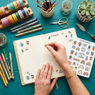 Decorating a notebook with custom sticker sheet designs